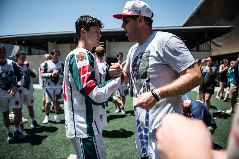 Coach and athlete shaking hands